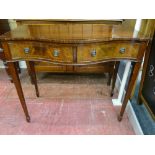 A REPRODUCTION MAHOGANY SERPENTINE FRONT SIDE TABLE having twin frieze drawers with ring pull
