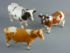 THREE BESWICK POTTERY CATTLE to include a first version Jersey cow, an Ayrshire bull 'Champion