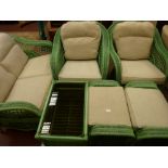 A SIX PIECE GREEN WICKER CONSERVATORY SUITE comprising two seater settee, twin armchairs with