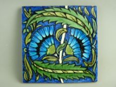 WILLIAM DE MORGAN NEAR 8 ins SQUARE TILE with floral and leaf decoration in typical form on a blue