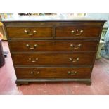 A LATE GEORGIAN MAHOGANY CHEST of two short over three long drawers, all oak lined with circular