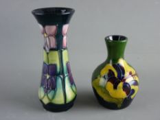 TWO MOORCROFT 'HIBISCUS' & 'VIOLET' VASES, 9.5 and 13 cms high respectively, decorated on tonal