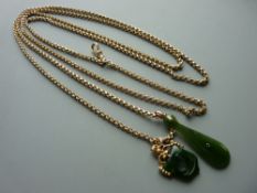 A 57 ins NINE CARAT GOLD BELCHER CHAIN with swivel fob clip and two New Zealand jade pendants, 25
