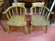A PAIR OF VINTAGE SMOKER'S BOW ARMCHAIRS, 71 cms high, 61 cms wide, having turned spindlebacks,