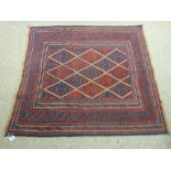 A TRIBAL CAZAK RUG, the central block diamond pattern having a continuous triple border and