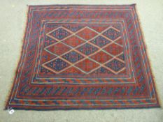 A TRIBAL CAZAK RUG, the central block diamond pattern having a continuous triple border and