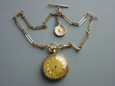 AN EXCELLENT NINE CARAT GOLD OPEN FACED FOB WATCH and Albert chain, the gilt dial set with Roman