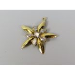 A DIAMOND STAR SHAPED PENDANT in believed 18ct yellow gold (unmarked), 1.6gms