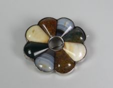 A SILVER & AGATE BROOCH in circular fanned form with hollow circular centre, 4.75cms diam