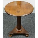 NINETEENTH CENTURY MAHOGANY CIRCULAR TOP TRIPOD TABLE raised over bun feet, 52cms diam