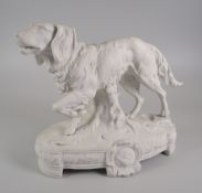A CONTINENTAL PARIAN PORCELAIN MODEL OF A RED-SETTER on an oval footed naturalistic base, 19cms