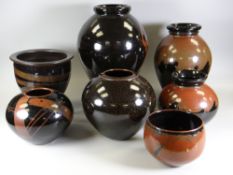 SEVEN VARIOUS STUDIO POTTERY VESSELS each of similar glaze decoration and with similar potter's