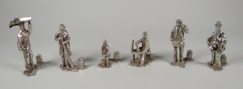 A SET OF SIX STREET HAWKER FIGURAL MENU HOLDERS by Thomas Charles Jarvis, each figure with a