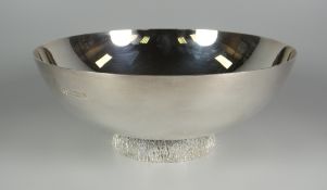 AN ELIZABETH II SILVER BOWL of plain form and with textured foot, Sheffield 1991, by Camelot