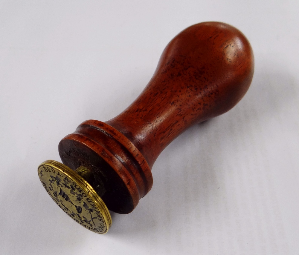 A 17TH CENTURY BOHEMIAN BRASS DESK-SEAL for the crossing of wine over Eastern European borders,