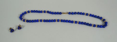 A NECKLACE OF LAPIS LAZULI BEADS with 9ct yellow gold spacers and matching earrings