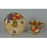 A ROYAL WORCESTER FRUIT DECORATED MINIATURE CUP & SAUCER the saucer signed by Freeman Provenance: