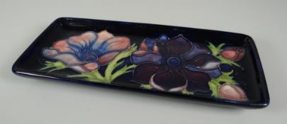 A MOORCROFT POTTERY RECTANGULAR DISH in the 'Anemone' floral pattern with tube-lined flowers