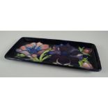 A MOORCROFT POTTERY RECTANGULAR DISH in the 'Anemone' floral pattern with tube-lined flowers