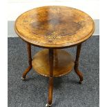 AN EDWARDIAN WALNUT MARQUETRY TOP TABLE of circular form with lower platform & on ceramic castors,