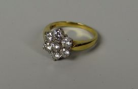 A DIAMOND FLORAL CLUSTER RING, set in 18ct yellow gold, 4.3gms, visual estimate 1ct total