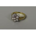 A DIAMOND FLORAL CLUSTER RING, set in 18ct yellow gold, 4.3gms, visual estimate 1ct total