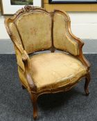 FRENCH SALOON ARMCHAIR of carved shaped form with cushioned seat and three section upholstered back