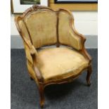 FRENCH SALOON ARMCHAIR of carved shaped form with cushioned seat and three section upholstered back