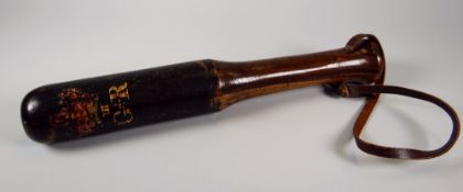 A GEORGE III PAINTED TRUNCHEON with crown and cypher, leather strap, 30cms long