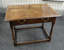 AN NINETEENTH CENTURY OAK LOW-BOY with single drawer, over turned and block supports and low-stretc