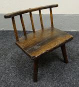 CHILD'S STICK BACK CHAIR in elm, circa 1800, on three feet and with shaped rail and five