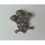 A STERLING SILVER & MARCASITE BROOCH IN THE FORM OF PRINCE OF WALES FEATHERS, marked 925, 3cms high