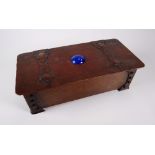 AN ARTS & CRAFTS COPPER CASKET riveted with a hammered finish, having oversize Gothic hinges and a