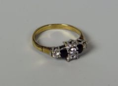 A DIAMOND & SAPPHIRE RING in 9ct yellow gold, 2.1gms