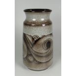 A POOLE POTTERY VASE of slightly tapering form with inverted neck and having a mottled glaze and