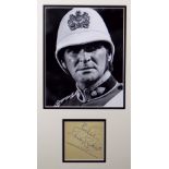 STANLEY BAKER autograph with 'Best Wishes' on paper and framed together with a still photograph