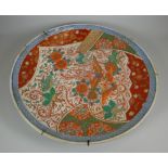 AN IMARI POTTERY CHARGER typically decorated with blue border and exotic flora and fauna, 46cms