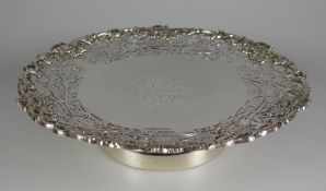 A SILVER TAZZA the wide border with open work scrolls leaf decoration and with a vine-form