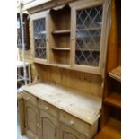 A stripped pine semi-glazed kitchen dresser