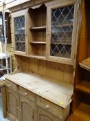 A stripped pine semi-glazed kitchen dresser