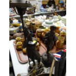 Continental spelter figure of a schoolboy together with a Spanish soldier in the form of a table