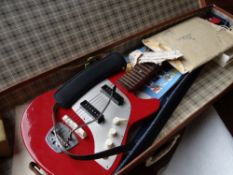 A vintage cased Futurama electric guitar