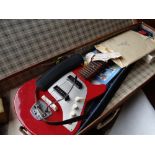 A vintage cased Futurama electric guitar