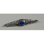 A SILVER FILIGREE BROOCH set with raised oval blue mineral (BBC Bargain Hunt)