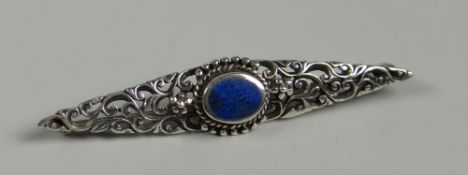 A SILVER FILIGREE BROOCH set with raised oval blue mineral (BBC Bargain Hunt)