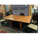 An Art Deco-style wood effect & ebony bordered dining table together with four matching high back b