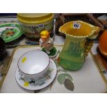 A Crown Staffordshire Queensbury golfing large cup & saucer, a Burleighware golfing handled jug &