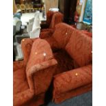 A good quality lounge suite comprising two-seater sofa, two wingback armchairs in a red two-tone