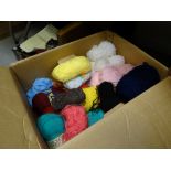 A box of various coloured knitting wool