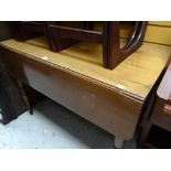 An antique mahogany drop flap table